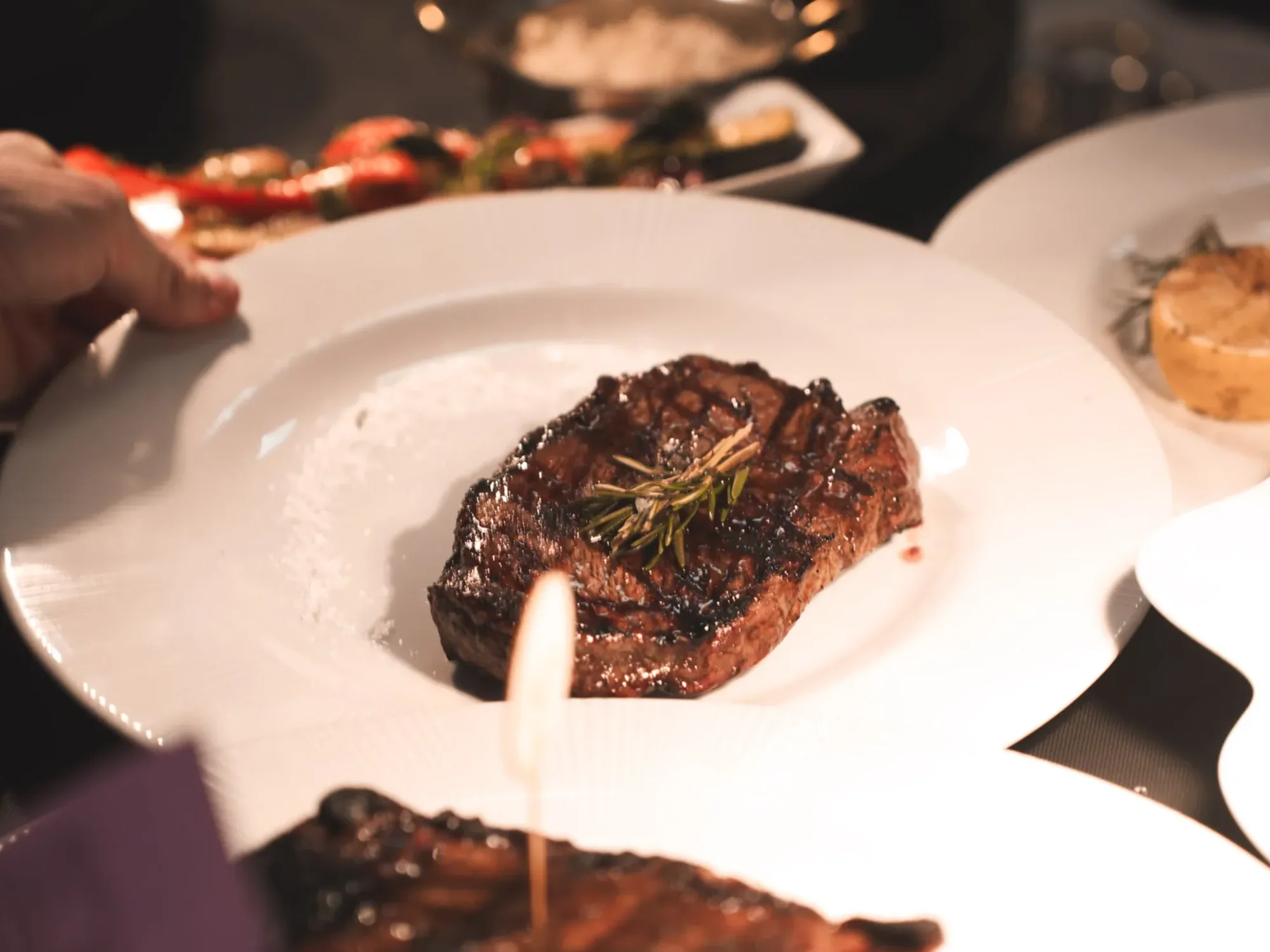 A grilled steak served at the table